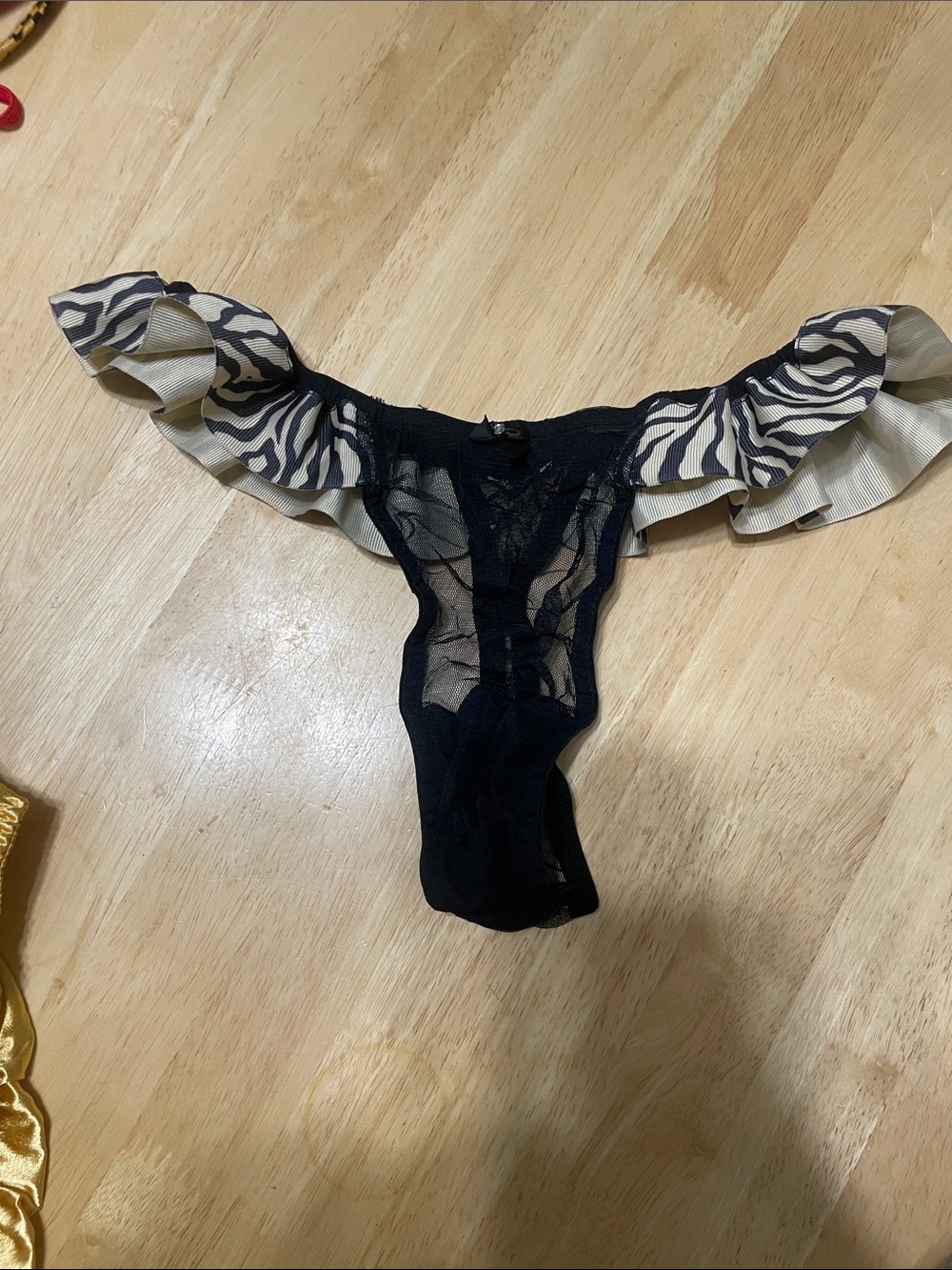 Sheer Black Lace Thong with Zebra-Print Ruffle